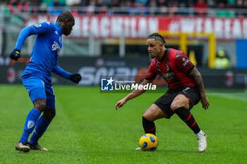 2024-03-10 - Noah Okafor of AC Milan seen in action with Emmanuel Gyasi of Empoli FC during Serie A 2023/24 football match between AC Milan and Empoli FC at San Siro Stadium, Milan, Italy on March 10, 2024 - AC MILAN VS EMPOLI FC - ITALIAN SERIE A - SOCCER