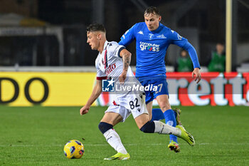 2024-03-15 - Bologna FC's midfielder Kacper Urbanski against Empoli FC's midfielder Szymon Zurkowski - EMPOLI FC VS BOLOGNA FC - ITALIAN SERIE A - SOCCER