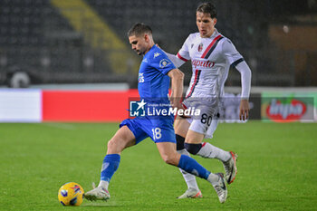 2024-03-15 - Empoli FC's midfielder Razvan Marin against Bologna FC's midfielder Giovanni Fabbian - EMPOLI FC VS BOLOGNA FC - ITALIAN SERIE A - SOCCER