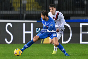 2024-03-15 - Empoli FC's defender Bartosz Bereszynski against Bologna FC's midfielder Alexis Saelemaekers - EMPOLI FC VS BOLOGNA FC - ITALIAN SERIE A - SOCCER