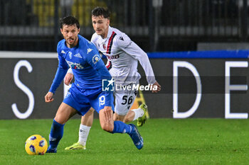 2024-03-15 - Empoli FC's defender Bartosz Bereszynski against Bologna FC's midfielder Alexis Saelemaekers - EMPOLI FC VS BOLOGNA FC - ITALIAN SERIE A - SOCCER