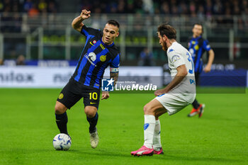 2024-04-01 - Lautaro Martinez of FC Internazionale competes for the ball with Simone Bastoni of Empoli FC during Serie A 2023/24 football match between FC Internazionale and Empoli FC at Giuseppe Meazza Stadium, Milan, Italy on April 01, 2024 - INTER - FC INTERNAZIONALE VS EMPOLI FC - ITALIAN SERIE A - SOCCER