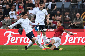 2024-04-06 - Daichi Kamada of S.S. Lazio and Paulo Dybala of A.S. Roma during the 31th day of the Serie A Championship between A.S. Roma vs S.S. Lazio, 6 April, 2024 at the Olympic Stadium in Rome, Italy. - AS ROMA VS SS LAZIO - ITALIAN SERIE A - SOCCER