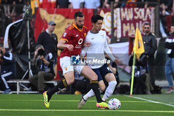 2024-04-06 - Bryan Cristante of A.S. Roma and Daichi Kamada of S.S. Lazio during the 31th day of the Serie A Championship between A.S. Roma vs S.S. Lazio, 6 April, 2024 at the Olympic Stadium in Rome, Italy. - AS ROMA VS SS LAZIO - ITALIAN SERIE A - SOCCER