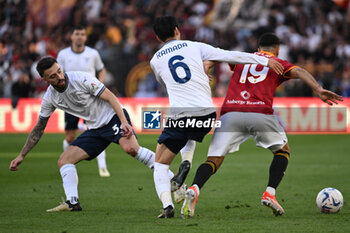 2024-04-06 - Daichi Kamada of S.S. Lazio and Zeki Celik of A.S. Roma during the 31th day of the Serie A Championship between A.S. Roma vs S.S. Lazio, 6 April, 2024 at the Olympic Stadium in Rome, Italy. - AS ROMA VS SS LAZIO - ITALIAN SERIE A - SOCCER