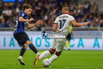 2024-04-14 - Nicolo Barella of FC Internazionale competes for the ball with Pantelis Hatzidiakos of Cagliari Calcio during Serie A 2023/24 football match between FC Internazionale and Cagliari Calcio at Giuseppe Meazza Stadium, Milan, Italy on April 14, 2024 - INTER - FC INTERNAZIONALE VS CAGLIARI CALCIO - ITALIAN SERIE A - SOCCER