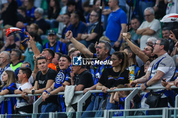 2024-04-14 - FC Internazionale supporters celebrate during Serie A 2023/24 football match between FC Internazionale and Cagliari Calcio at Giuseppe Meazza Stadium, Milan, Italy on April 14, 2024 - INTER - FC INTERNAZIONALE VS CAGLIARI CALCIO - ITALIAN SERIE A - SOCCER