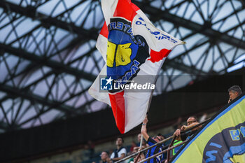 2024-04-14 - A fan waves a giant flag during Serie A 2023/24 football match between FC Internazionale and Cagliari Calcio at Giuseppe Meazza Stadium, Milan, Italy on April 14, 2024 - INTER - FC INTERNAZIONALE VS CAGLIARI CALCIO - ITALIAN SERIE A - SOCCER