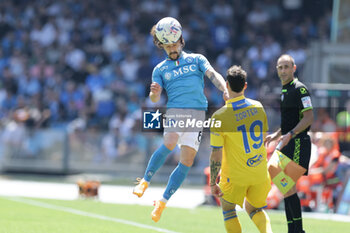 2024-04-14 - SSC Napoli's Portuguese defender Mario Rui challenges for the ball with Frosinone's Italian defender Nadir Zortea during the Serie A football match between SSC Napoli and Frosinone at the Diego Armando Maradona Stadium in Naples, southern Italy, on April 14, 2024. - SSC NAPOLI VS FROSINONE CALCIO - ITALIAN SERIE A - SOCCER