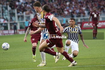 2024-04-13 - Danilo Luiz da Silva (Juventus FC) and Dusan Vlahovic (Juventus FC) in action - TORINO FC VS JUVENTUS FC - ITALIAN SERIE A - SOCCER