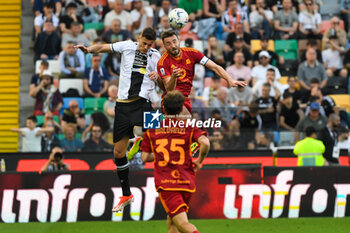 2024-04-14 - Header of Udinese's Lorenzo Lucca and Roma’s Bryan Cristante - UDINESE CALCIO VS AS ROMA - ITALIAN SERIE A - SOCCER