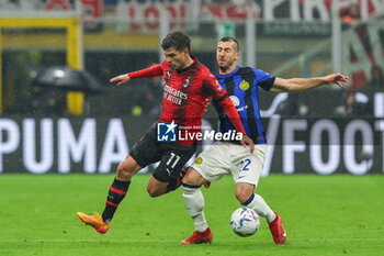 2024-04-22 - Christian Pulisic of AC Milan and Henrikh Mkhitaryan of FC Internazionale seen in action during Serie A 2023/24 football match between AC Milan and FC Internazionale at San Siro Stadium, Milan, Italy on April 22, 2024 - AC MILAN VS INTER - FC INTERNAZIONALE - ITALIAN SERIE A - SOCCER