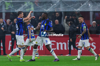 2024-04-22 - Marcus Thuram of FC Internazionale celebrates after scoring a goal during Serie A 2023/24 football match between AC Milan and FC Internazionale at San Siro Stadium, Milan, Italy on April 22, 2024 - AC MILAN VS INTER - FC INTERNAZIONALE - ITALIAN SERIE A - SOCCER