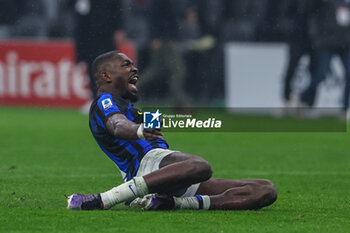 2024-04-22 - Marcus Thuram of FC Internazionale celebrates the victory of the Serie A 2023/24 title during Serie A 2023/24 football match between AC Milan and FC Internazionale at San Siro Stadium, Milan, Italy on April 22, 2024 - AC MILAN VS INTER - FC INTERNAZIONALE - ITALIAN SERIE A - SOCCER