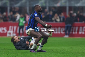 2024-04-22 - Marcus Thuram of FC Internazionale celebrates the victory of the Serie A 2023/24 title during Serie A 2023/24 football match between AC Milan and FC Internazionale at San Siro Stadium, Milan, Italy on April 22, 2024 - AC MILAN VS INTER - FC INTERNAZIONALE - ITALIAN SERIE A - SOCCER