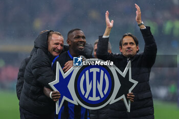 2024-04-22 - Marcus Thuram of FC Internazionale celebrates the victory of the Serie A 2023/24 title with Simone Inzaghi Head Coach of FC Internazionale during Serie A 2023/24 football match between AC Milan and FC Internazionale at San Siro Stadium, Milan, Italy on April 22, 2024 - AC MILAN VS INTER - FC INTERNAZIONALE - ITALIAN SERIE A - SOCCER