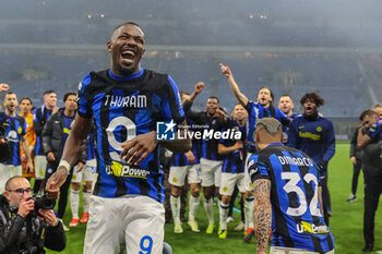 2024-04-22 - Marcus Thuram of FC Internazionale smiles after dancing in front of fans and teammates as they celebrate the club's 20th Scudetto during Serie A 2023/24 football match between AC Milan and FC Internazionale at San Siro Stadium, Milan, Italy on April 22, 2024 - AC MILAN VS INTER - FC INTERNAZIONALE - ITALIAN SERIE A - SOCCER