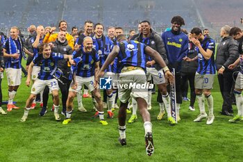 2024-04-22 - Marcus Thuram of FC Internazionale celebrate the club's 20th Scudetto with his team mates during Serie A 2023/24 football match between AC Milan and FC Internazionale at San Siro Stadium, Milan, Italy on April 22, 2024 - AC MILAN VS INTER - FC INTERNAZIONALE - ITALIAN SERIE A - SOCCER