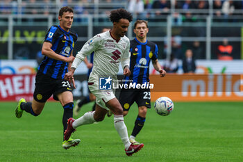 2024-04-28 - Valentino Lazaro of Torino FC (R) and Benjamin Pavard of FC Internazionale (L) seen in action during Serie A 2023/24 football match between FC Internazionale and Torino FC at Giuseppe Meazza Stadium, Milan, Italy on April 28, 2024 - INTER - FC INTERNAZIONALE VS TORINO FC - ITALIAN SERIE A - SOCCER