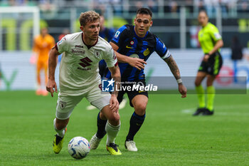 2024-04-28 - Matteo Lovato of Torino FC (L) competes for the ball with Lautaro Martinez of FC Internazionale (R) during Serie A 2023/24 football match between FC Internazionale and Torino FC at Giuseppe Meazza Stadium, Milan, Italy on April 28, 2024 - INTER - FC INTERNAZIONALE VS TORINO FC - ITALIAN SERIE A - SOCCER