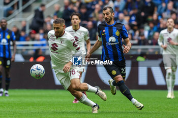 2024-04-28 - Nikola Vlasic of Torino FC (L) and Henrikh Mkhitaryan of FC Internazionale (R) seen in action during Serie A 2023/24 football match between FC Internazionale and Torino FC at Giuseppe Meazza Stadium, Milan, Italy on April 28, 2024 - INTER - FC INTERNAZIONALE VS TORINO FC - ITALIAN SERIE A - SOCCER
