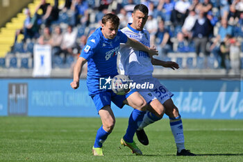 2024-05-05 - Empoli FC's midfielder Szymon Zurkowski against Frosinone Calcio's midfielder Luca Mazzitelli - EMPOLI FC VS FROSINONE CALCIO - ITALIAN SERIE A - SOCCER