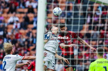2024-05-05 - Olivier Giroud of AC Milan seen in action with Giorgio Cittadini of Genoa CFC during Serie A 2023/24 football match between AC Milan and Genoa CFC at San Siro Stadium, Milan, Italy on May 05, 2024 - AC MILAN VS GENOA CFC - ITALIAN SERIE A - SOCCER