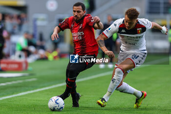 05/05/2024 - Mateo Retegui of Genoa CFC (R) competes for the ball with Ismael Bennacer of AC Milan (L) during Serie A 2023/24 football match between AC Milan and Genoa CFC at San Siro Stadium, Milan, Italy on May 05, 2024 - AC MILAN VS GENOA CFC - SERIE A - CALCIO
