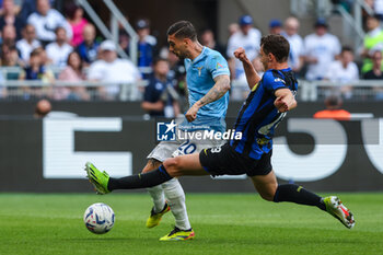 2024-05-19 - Mattia Zaccagni of SS Lazio seen in action with Benjamin Pavard of FC Internazionale during Serie A 2023/24 football match between FC Internazionale and SS Lazio at Giuseppe Meazza Stadium, Milan, Italy on May 19, 2024 - INTER - FC INTERNAZIONALE VS SS LAZIO - ITALIAN SERIE A - SOCCER