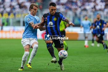 2024-05-19 - Lautaro Martinez of FC Internazionale competes for the ball with Nicolo Rovella of SS Lazio during Serie A 2023/24 football match between FC Internazionale and SS Lazio at Giuseppe Meazza Stadium, Milan, Italy on May 19, 2024 - INTER - FC INTERNAZIONALE VS SS LAZIO - ITALIAN SERIE A - SOCCER