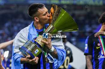 2024-05-19 - Lautaro Martinez of FC Internazionale poses with the Scudetto trophy during Serie A 2023/24 football match between FC Internazionale and SS Lazio at Giuseppe Meazza Stadium, Milan, Italy on May 19, 2024 - INTER - FC INTERNAZIONALE VS SS LAZIO - ITALIAN SERIE A - SOCCER