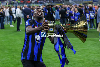 2024-05-19 - Marcus Thuram of FC Internazionale celebrates with the Scudetto trophy during Serie A 2023/24 football match between FC Internazionale and SS Lazio at Giuseppe Meazza Stadium, Milan, Italy on May 19, 2024 - INTER - FC INTERNAZIONALE VS SS LAZIO - ITALIAN SERIE A - SOCCER