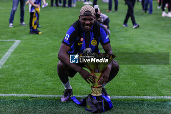 2024-05-19 - Marcus Thuram of FC Internazionale celebrates with the Scudetto trophy during Serie A 2023/24 football match between FC Internazionale and SS Lazio at Giuseppe Meazza Stadium, Milan, Italy on May 19, 2024 - INTER - FC INTERNAZIONALE VS SS LAZIO - ITALIAN SERIE A - SOCCER