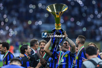 2024-05-19 - Lautaro Martinez of FC Internazionale celebrates with the Scudetto trophy during Serie A 2023/24 football match between FC Internazionale and SS Lazio at Giuseppe Meazza Stadium, Milan, Italy on May 19, 2024 - INTER - FC INTERNAZIONALE VS SS LAZIO - ITALIAN SERIE A - SOCCER