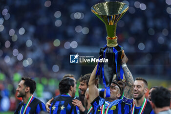 2024-05-19 - Lautaro Martinez of FC Internazionale celebrates with the trophy as FC Internazionale celebrates it's 20th league title following the Serie A 2023/24 football match between FC Internazionale and SS Lazio at Giuseppe Meazza Stadium, Milan, Italy on May 19, 2024 - INTER - FC INTERNAZIONALE VS SS LAZIO - ITALIAN SERIE A - SOCCER