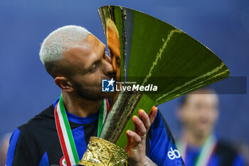 2024-05-19 - Federico Dimarco of FC Internazionale poses with the trophy as FC Internazionale celebrates it's 20th league title following the Serie A 2023/24 football match between FC Internazionale and SS Lazio at Giuseppe Meazza Stadium, Milan, Italy on May 19, 2024 - INTER - FC INTERNAZIONALE VS SS LAZIO - ITALIAN SERIE A - SOCCER