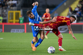 2024-05-26 - AS Roma's midfielder Houssem Aouar against Empoli FC's midfielder Simone Bastoni - EMPOLI FC VS AS ROMA - ITALIAN SERIE A - SOCCER