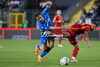 2024-05-26 - AS Roma's midfielder Houssem Aouar against Empoli FC's midfielder Simone Bastoni - EMPOLI FC VS AS ROMA - ITALIAN SERIE A - SOCCER