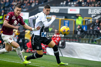 2024-03-16 - Udinese's Lorenzo Lucca in action against Torino's Alessandro Buongiorno - UDINESE CALCIO VS TORINO FC - ITALIAN SERIE A - SOCCER