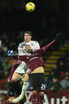 2024-01-07 - Dusan Vlahovic of Juventus FC competes for the ball with Dylan Bronn of US Salernitana 1919 during Serie A between US Salernitana 1919 vs Juventus FC at Arechi Stadium - US SALERNITANA VS JUVENTUS FC - ITALIAN SERIE A - SOCCER