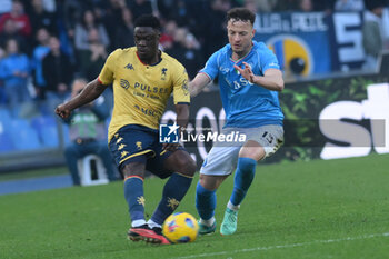 2024-02-17 - Amir Rrahmano of SSC Napoli competes for the ball with Caleb Ekuban of Genoa CFC during Serie A Match between SSC Napoli vs Genoa CFC at Diego Armando Maradona Stadium - SSC NAPOLI VS GENOA CFC - ITALIAN SERIE A - SOCCER