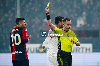 2024-01-09 - Ermanno Feliciani (Referee) shows the yellow card during the Italian championship Serie A football match between Genoa CFC and AC Monza on March 9, 2024 at Stade Luigi-Ferraris in Genoa, Italy - FOOTBALL - ITALIAN CHAMP - GENOA V MONZA - ITALIAN SERIE A - SOCCER
