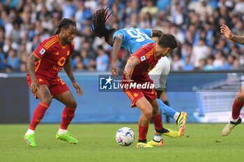 2024-04-28 - Zambo Anguissa of SSC Napoli competes for the ball with Paulo Dybala of AS Roma during the Serie A Match between SSC Napoli vs AS Roma at Diego Armando Maradona Stadium - SSC NAPOLI VS AS ROMA - ITALIAN SERIE A - SOCCER