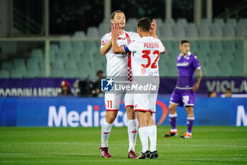 2024-05-13 - Milan Duric (AC Monza) celebrates the goal with Matteo Pessina (AC Monza) during the Italian championship Serie A football match between ACF Fiorentina and AC Monza on May 13, 2024 at the Artemio Franchi stadium in Florence, Italy - FOOTBALL - ITALIAN CHAMP - FIORENTINA V MONZA - ITALIAN SERIE A - SOCCER