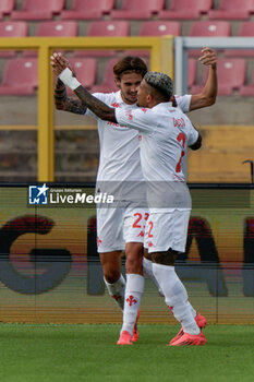 2024-10-20 - Andrea Colpani of Fiorentina celebrates after scoring a goal with Dodo of Fiorentina - US LECCE VS ACF FIORENTINA - ITALIAN SERIE A - SOCCER