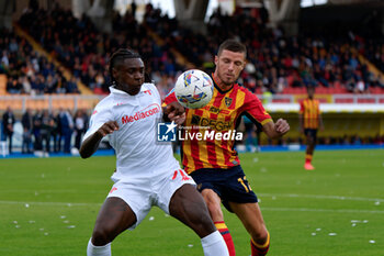 2024-10-20 - Moise Kean of Fiorentina in action against Frederic Guilbert of US Lecce - US LECCE VS ACF FIORENTINA - ITALIAN SERIE A - SOCCER