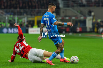 2024-10-29 - Filippo Terracciano of AC Milan competes for the ball with Matteo Politano of SSC Napoli during Serie A 2024/25 football match between AC Milan and SSC Napoli at San Siro Stadium - AC MILAN VS SSC NAPOLI - ITALIAN SERIE A - SOCCER