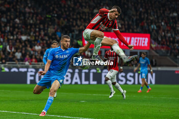 2024-10-29 - Alvaro Morata of AC Milan seen in action with Alessandro Buomgiorno of SSC Napoli during Serie A 2024/25 football match between AC Milan and SSC Napoli at San Siro Stadium - AC MILAN VS SSC NAPOLI - ITALIAN SERIE A - SOCCER