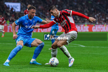 2024-10-29 - Alvaro Morata of AC Milan competes for the ball with Amir Rrahmani of SSC Napoli during Serie A 2024/25 football match between AC Milan and SSC Napoli at San Siro Stadium - AC MILAN VS SSC NAPOLI - ITALIAN SERIE A - SOCCER