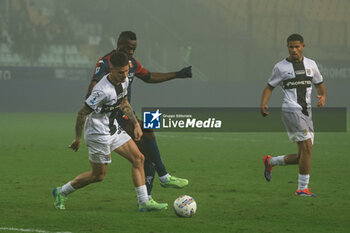 2024-11-04 - Mario Balotelli (Genoa CFC) fights for the ball against Dennis Man (Parma Calcio) - PARMA CALCIO VS GENOA CFC - ITALIAN SERIE A - SOCCER